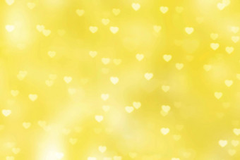 模糊心形状灯散景黄色的背景色彩斑斓的散景灯心软壁纸闪光心形状明亮的散景情人节浪漫的背景