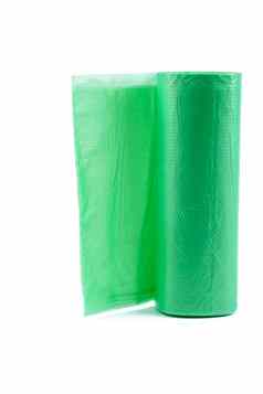 卷绿色塑料垃圾袋卷绿色塑料垃圾袋孤立的白色背景