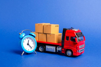 红色的卡车纸板盒子蓝色的报警时钟表达交付短时间概念临时存储有限的提供折扣优化交付物流运输公司