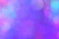 模糊梯度紫罗兰色的紫色的散景光闪闪发光的发光背景奢侈品