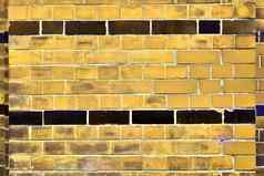 详细的视图色彩斑斓的饱经风霜的砖墙纹理
