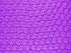 针织羊毛背景紫罗兰色的