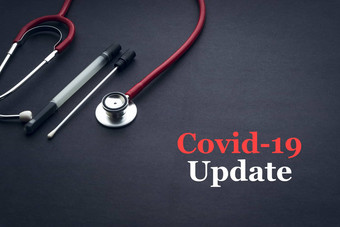 科维德冠状病毒更新文本听诊器医疗拭子黑色的背景