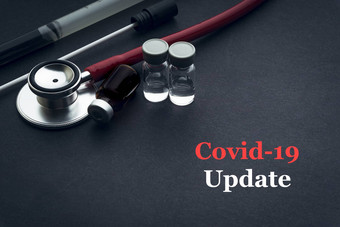 科维德冠状病毒更新文本听诊器医疗拭子瓶黑色的背景