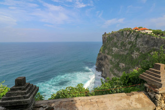 视图Uluwatu悬崖展馆蓝色的海<strong>巴厘岛</strong>印尼美丽的<strong>风景</strong>普拉崇高Uluwatu寺庙色彩斑斓的花前景一天<strong>风景</strong>优美的沿海景观高悬崖