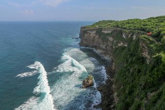 视图Uluwatu悬崖展馆蓝色的海<strong>巴厘岛</strong>印尼美丽的<strong>风景</strong>普拉崇高Uluwatu寺庙色彩斑斓的花前景一天<strong>风景</strong>优美的沿海景观高悬崖