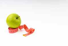 绿色苹果红色的测量磁带健康护理健身概念