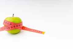 绿色苹果红色的测量磁带健康护理健身概念