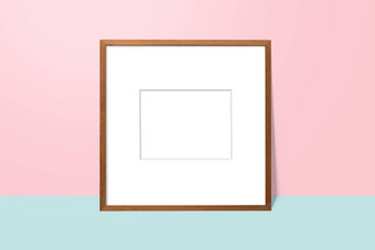 空白色空间木空白框架倾斜粉红色的墙蓝色的地板上简单的空白照片框架演讲装修背景