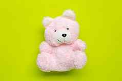 玩具粉红色的熊绿色背景