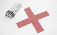 世界烟草一天堆香烟过滤器孤立的白色背景红色的交叉象征