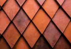 关闭纹理橙色菱形砖墙外室内设计建筑材料背景概念