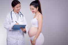 怀孕母亲人医学生育能力概念快乐怀孕了女人医生孕妇医院