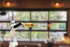聪明的机器人食物持有汉堡餐厅未来主义的机器人自动化增加效率