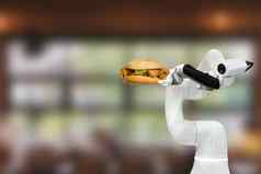 聪明的机器人食物持有汉堡餐厅未来主义的机器人自动化增加效率