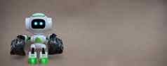 机器人持有垃圾袋技术回收环境灰色的背景