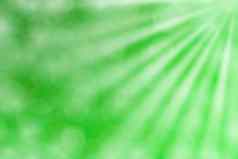 色彩斑斓的绿色散景灯梁发光梯度绿色背景复制空间散景色彩斑斓的光绿色软阴影散景灯发光梯度软绿色