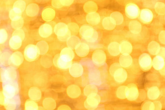 软散景黄<strong>金黄色</strong>的背景散景黄<strong>金黄色</strong>的色彩斑斓的快乐圣诞节快乐一年散景照明发光晚上散景闪闪发光的光金奢侈品背景闪闪发光的壁纸