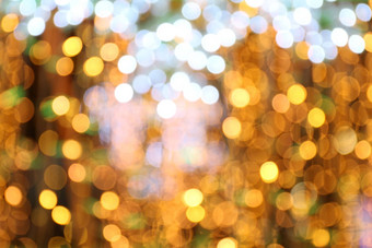 软散景黄金黄色的背景散景黄金黄色的色彩斑斓的快乐圣诞节快乐一年散景照明发光晚上散景闪闪发光的光金奢侈品背景闪闪发光的壁纸