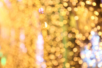 软散景黄<strong>金黄色</strong>的背景散景黄<strong>金黄色</strong>的色彩斑斓的快乐圣诞节快乐一年散景照明发光晚上散景闪闪发光的光金奢侈品背景闪闪发光的壁纸