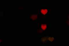 情人节红色的心形的黑色的背景色彩斑斓的照明散景装饰晚上背景壁纸模糊情人节爱背景照明心形状的软晚上摘要