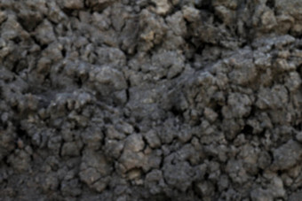 模糊背景土壤腐殖质黑色的粘土土壤纹理土地模糊模糊泥土壤