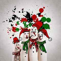 可爱的家庭手画手指雪人概念的想法