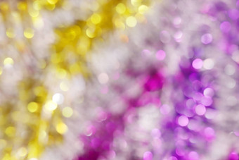 模糊图片黄色的黄金紫色的散景色彩斑斓的闪闪发光的快乐圣诞节快乐一年节日背景设计