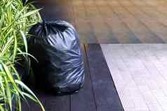 浪费塑料袋垃圾袋塑料黑色的地板上垃圾垃圾本污染浪费塑料浪费人行道上