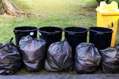 浪费垃圾黑色的袋本桩本垃圾垃圾污垢垃圾袋花园公共公园塑料浪费