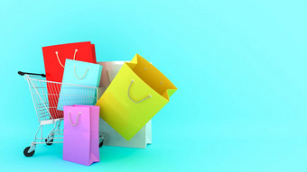 色彩鲜艳的纸购物袋购物车蓝色的背景购物情人购物狂概念呈现