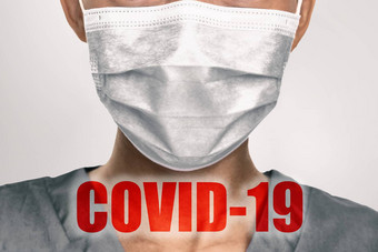 冠状病毒预防医生穿预防外科手术脸面具冠状病毒科维德文本红色的覆盖医疗工人背景