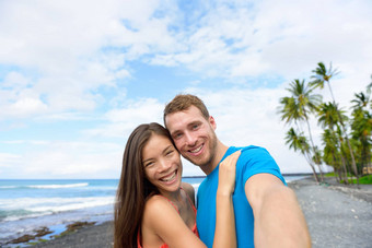 自拍夫妇夏威夷海滩假期采取图片智能手机夏天假期大岛夏威夷旅行目的地人有趣的视频博客社会媒体夏威夷假期