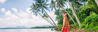 塔希提岛奢侈品异国情调的旅行假期女孩<strong>波利</strong>尼西亚花走海滩景观棕榈树亚洲女人红色的比基尼海滩装横幅全景