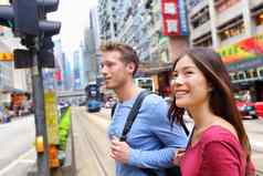 在香港香港人走铜锣湾穿越忙路缆车城市混合比赛亚洲中国人高加索人女人微笑快乐生活城市