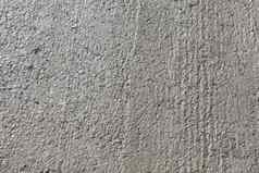 灰色混凝土粗糙的墙陷入困境的难看的东西纹理