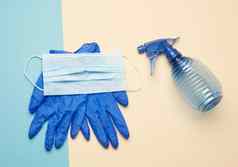 蓝色的手套可重用的纺织面具蓝色的瓶消毒