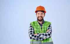 建设工人橙色硬他蓝色的背景格子衬衫反光背心