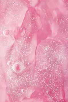 摘要粉红色的液体背景油漆飞溅漩涡模式水滴美过来这里化妆品纹理当代魔法艺术科学奢侈品平铺设计