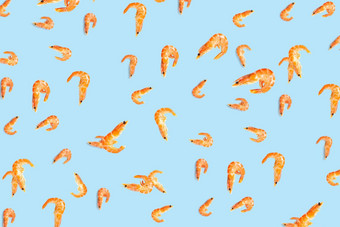 老虎虾海鲜背景使虾孤立的蓝色的背景现代背景煮熟的虾海鲜无缝的模式