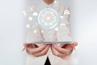业务女人触碰数字<strong>数据全息屏幕</strong>接口夫人统一的持有移动设备展示未来主义的虚拟显示图