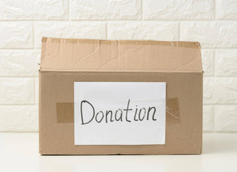 棕色（的）纸板盒子粘贴白色表登记捐赠白色背景