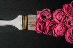 油漆刷画粉红色的花黑色的背景概念春天国际女人的母亲一天花绘画装饰有创意的