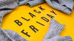 词黑色的星期五黄色的背景毛衣购物出售概念