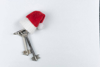 圣诞节装饰装饰房子关键锁圣诞老人他白色纸背景概念金融住房贷款前视图