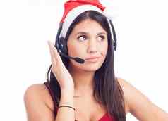 圣诞节耳机女人电话销售调用中心穿红色的圣诞老人他会说话的微笑孤立的白色背景