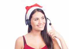 圣诞节耳机女人电话销售调用中心穿红色的圣诞老人他会说话的微笑孤立的白色背景