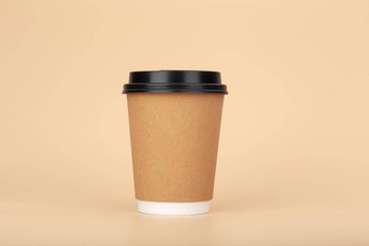 棕色（的）纸板杯<strong>咖啡</strong>柔和的米色背景