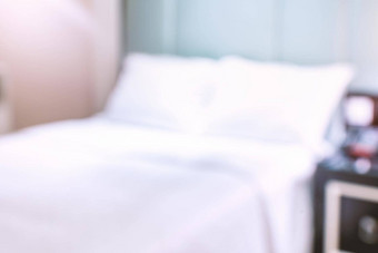 清洁舒适的现代酒店卧室室内双床上摘要散焦模糊散景背景设计概念奢侈品旅行