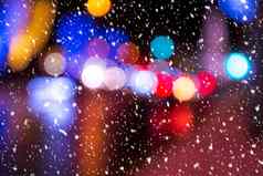 模糊灯头灯汽车灯笼晚上城市降雪摘要散景
